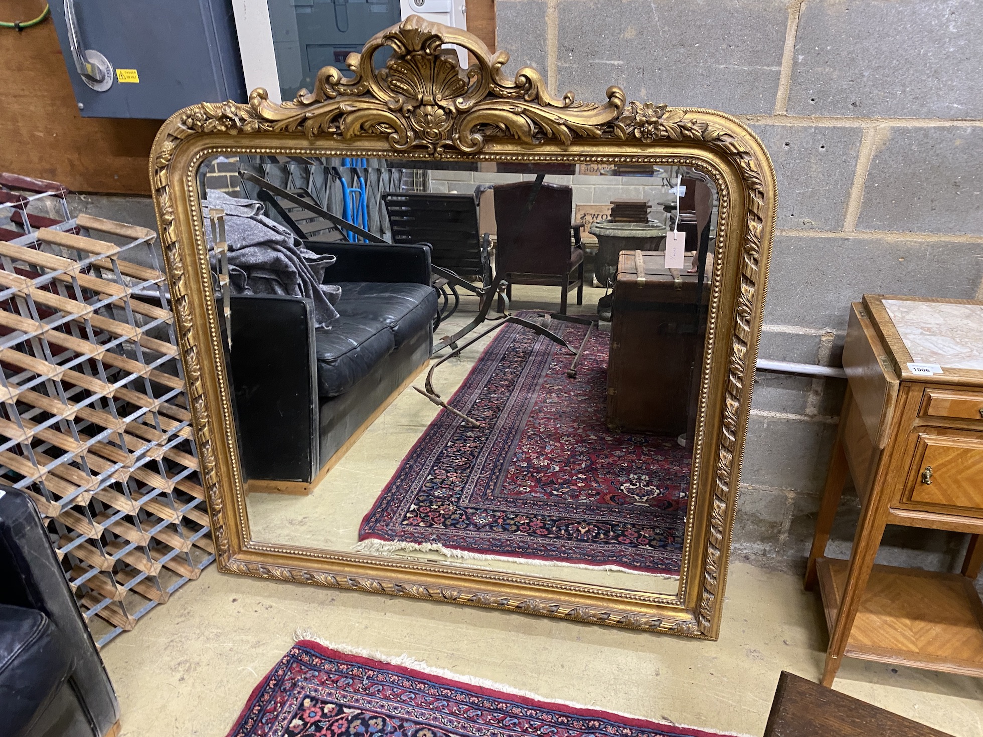 A Victorian style gilt composition overmantel mirror, width 130cm, height 137cm